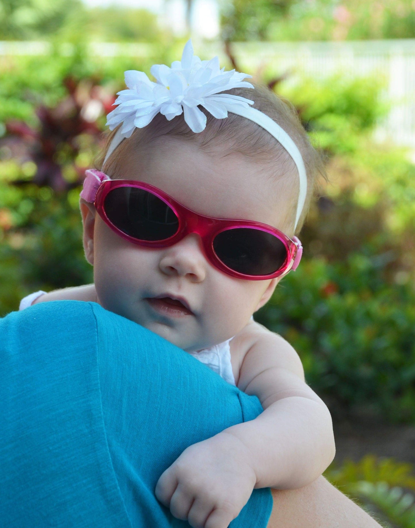 Baby BANZ wrap around sunglasses in Petal Pink with UV protection